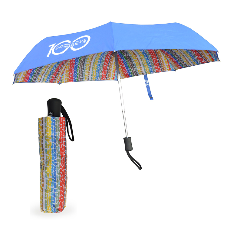 Umbrella with Alma Thomas painting pattern and Phillips centennial logo